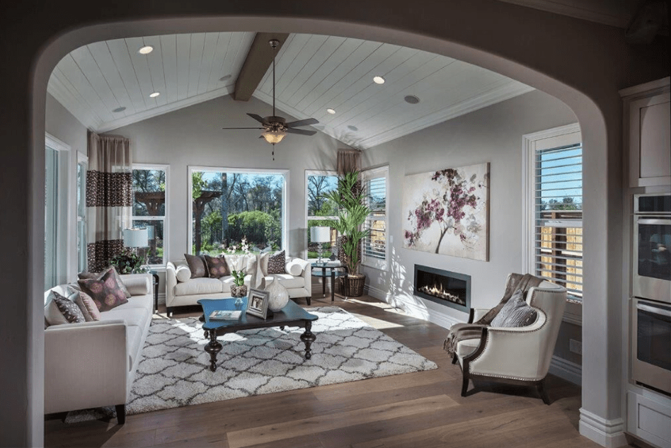 The floral accents in this living room at Crowne Point in Rocklin, CA are one of our 2018 design trends. 