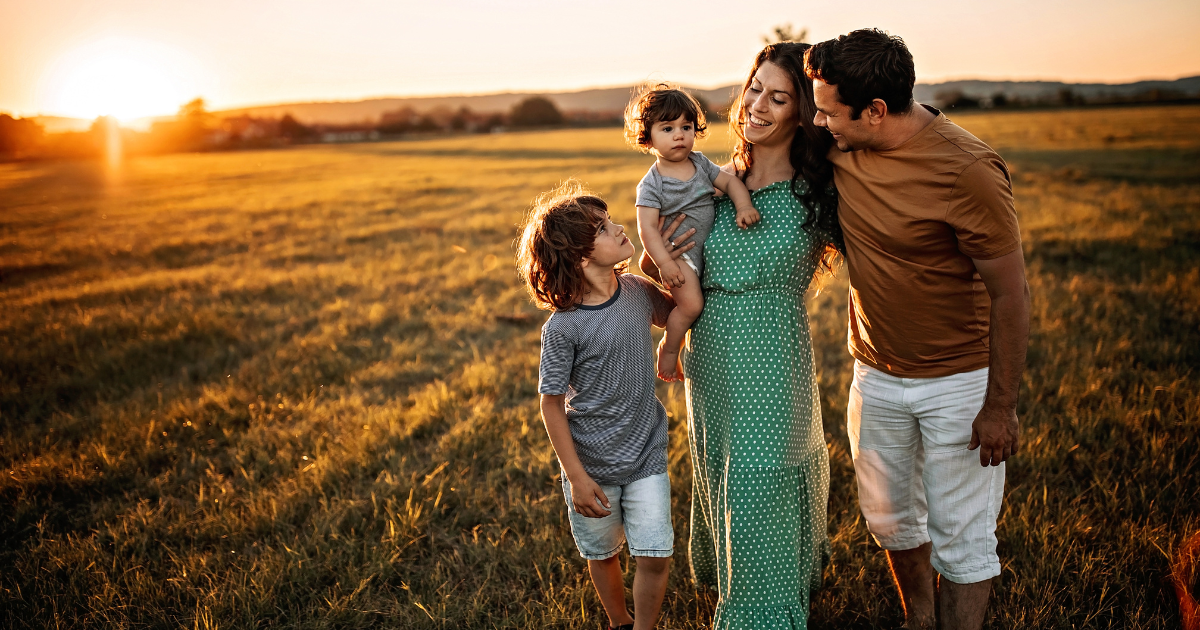 Family outside enjoying peace of mind after buying a new construction home from Tim Lewis Communities.